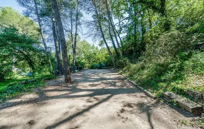 a dirt road in the middle of a forest at Cozy Home In Aix-En-Provence With Wifi in Aix-en-Provence