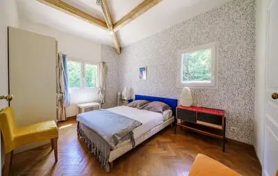 a bedroom with a bed and a desk and a window at Cozy Home In Aix-En-Provence With Wifi in Aix-en-Provence