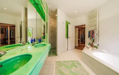 a bathroom with a tub and a sink and a tub and a bath tub at Cozy Home In Aix-En-Provence With Wifi in Aix-en-Provence