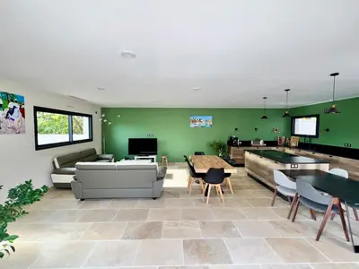 a living room with a couch and a table at La Villa de Jéna in Mazan