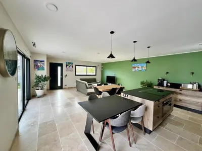 a living room with ping pong tables and green walls at La Villa de Jéna in Mazan