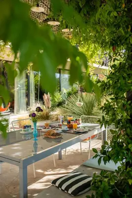 a table with food on it in a garden at Maison Jalon in Aix-en-Provence