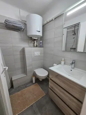 a bathroom with a toilet and a sink at Provençal-style apartment in Aix-en-Provence