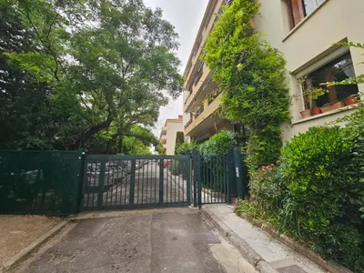 a gate in front of a building at Provençal-style apartment in Aix-en-Provence
