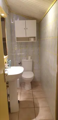 a small bathroom with a toilet and a sink at Chambre étudiant in Morières-lès-Avignon