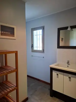 a bathroom with a sink and a window at La gloriette in Saumane-de-Vaucluse