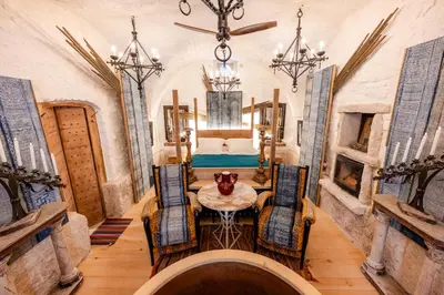 a dining room with a table and chairs at L'unique in Goult