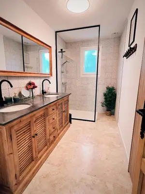 a bathroom with a sink and a shower at Oustau di Gaffo in LʼIsle-sur-la-Sorgue