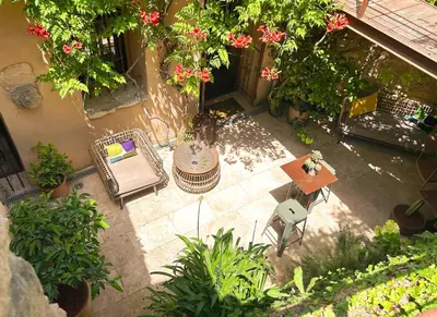 an overhead view of a patio with a table and chairs at La Cigalou - Bonnieux Centre in Bonnieux
