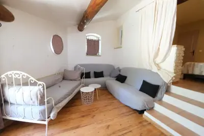 a living room with a couch and chairs at Air-conditioned house with heated pool, Luberon, in Maubec – 6 people in Maubec