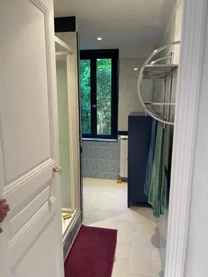 a bathroom with a walk in shower and a walk in closet at Bastide de la Couloubre in Mallemort