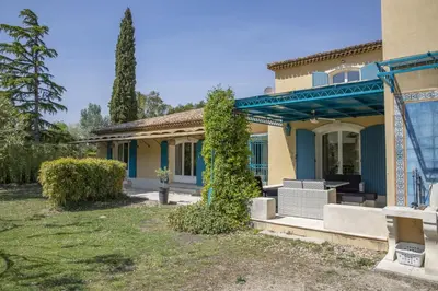 a home with a blue and yellow house at superb prestige property with indoor heated swimming pool, seminar room and tennis court in mouries, in the alpilles in provence – 16 people in Mouriès