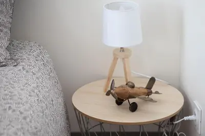 a table with a stuffed animal on it next to a bed at Le Partage des eaux - 4 couchages - Hypercentre - Clim - Wifi in LʼIsle-sur-la-Sorgue