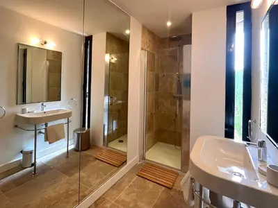 a bathroom with a shower and a sink at Le Clos de Yann in Gordes
