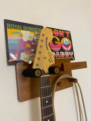 a guitar with a book on top of it at Inspiration maison entière avec jardin in Pernes-les-Fontaines