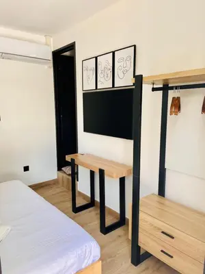 a room with a desk and a bed in it at La Villa Rustica in Aix-en-Provence
