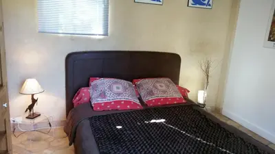 a bed with two pillows on it in a room at La Bastide des Muriers in Gargas