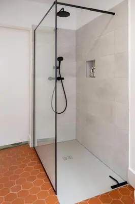 a shower with a glass door in a bathroom at Mistral126 in Aix-en-Provence