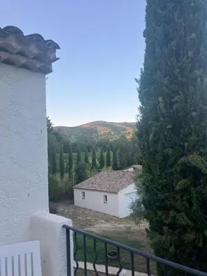 a view of a white building on a balcony at Villa Paradis des Oréades in Lauris