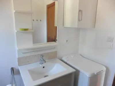 a white bathroom with a sink and a toilet at Maison face au Luberon avec piscine - 5 Chambres in Cabrières-dʼAvignon