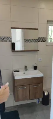 a bathroom with a sink and a mirror at Chez Lucho et carole in La Bastidonne