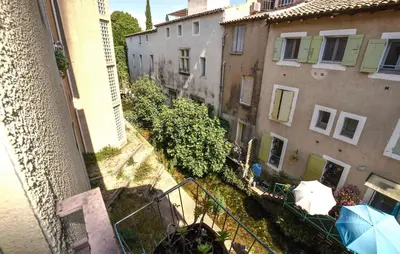 an overhead view of an alley between two buildings at Nice Apartment In L'isle-Sur-La-Sorgue in LʼIsle-sur-la-Sorgue