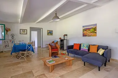a living room with a couch and a table at Mas de l'Aube in Mouriès