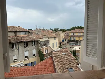 a kitchen and dining room with a table and chairs at Namasté in Aix-en-Provence