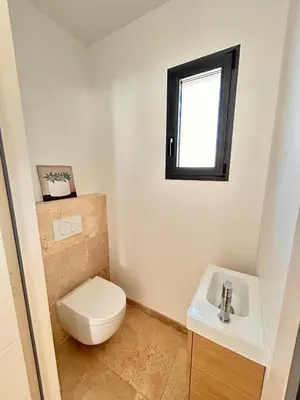 a bathroom with a toilet and a sink at Villa en Provence avec piscine in Mollégès