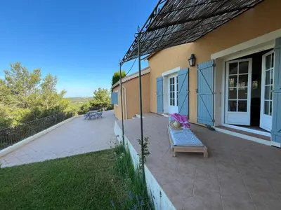 a porch of a house with a bench on it at Villa BELVENTO, superbe villa au calme, piscine, vue incroyable ! in Ventabren