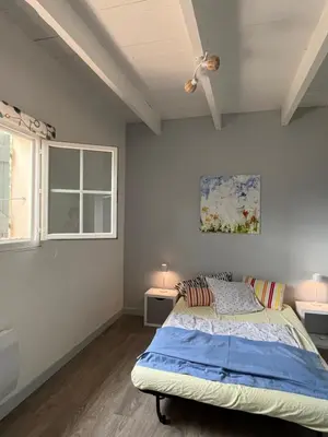 a bedroom with a bed and two windows at Villa BELVENTO, superbe villa au calme, piscine, vue incroyable ! in Ventabren