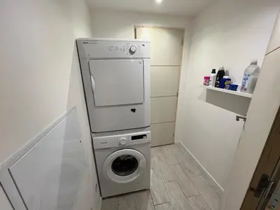 a washer and dryer in a small bathroom at L'Escale in Meyreuil