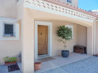 a kitchen and dining room with a table and chairs at Pretty, spacious holiday home with private pool in Villes-sur-Auzon