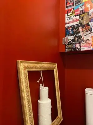 a mirror and a roll of toilet paper in a bathroom at Calussine maison provençale in Pernes-les-Fontaines