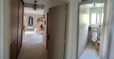 a hallway with a bathroom with a toilet in it at Chambre chez l'habitant à Pernes les Fontaines in Pernes-les-Fontaines