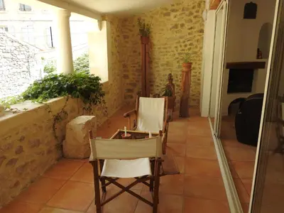 a room with two chairs and a table in a house at la capelette in Céreste