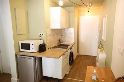 a small kitchen with a microwave and a sink at Studio Coconing Aix-en-Provence in Aix-en-Provence