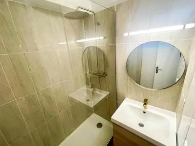 a bathroom with a sink and a mirror at Studio Coconing Aix-en-Provence in Aix-en-Provence