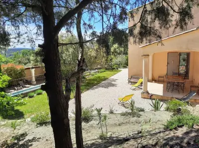 a view of the back of a house at Maison de vacances avec piscine privative, Oustau des Oliviers vue dominante Colorado provençal in Rustrel