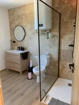 a bathroom with a toilet and a sink at Gîte Lavande Luberon in Saint-Saturnin-les-Apt