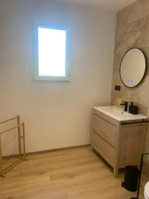 a bathroom with a sink and a mirror at Gîte Lavande Luberon in Saint-Saturnin-les-Apt