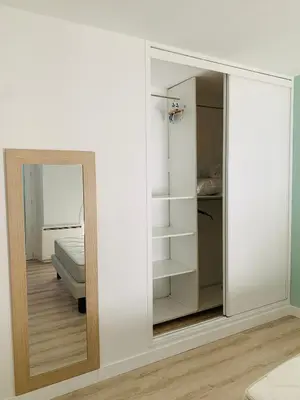 a mirror in a room with a bedroom at Le Nid Provençal in Lambesc