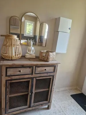 a room with a wooden dresser with a mirror at le mazet de LOÏS in Carpentras