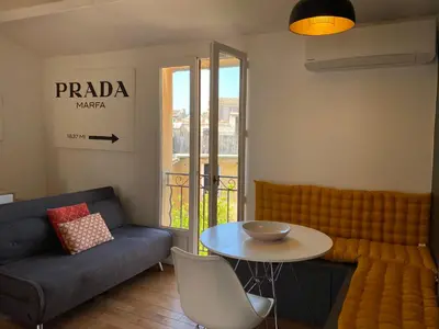 a living room with a couch and a table at Studio centre historique Aix en Provence in Aix-en-Provence