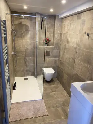 a bathroom with a shower and a toilet and a sink at Studio centre historique Aix en Provence in Aix-en-Provence