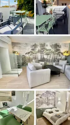 a living room with white chairs and a painting on the wall at Centre Historique Appartement Climatisé avec terrasse in Aix-en-Provence