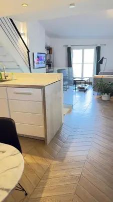 an office with a kitchen and a living room at Appartement climatisé 2 chambres Centre historique in Aix-en-Provence