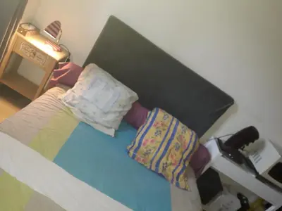 a room with a bed with a head board at Studio 107 in Aix-en-Provence