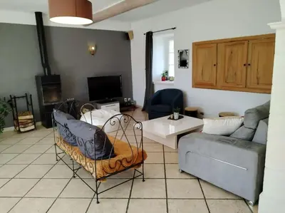 a living room with a couch and a table at Mas Aubert in Eyragues
