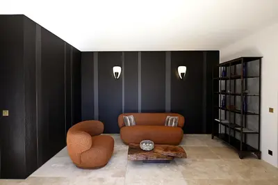 a living room with a couch and a table at La Suite Gordes in Gordes